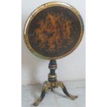 A Georgian tilt top tripod table ebonised and elaborately painted with gilt highlights,