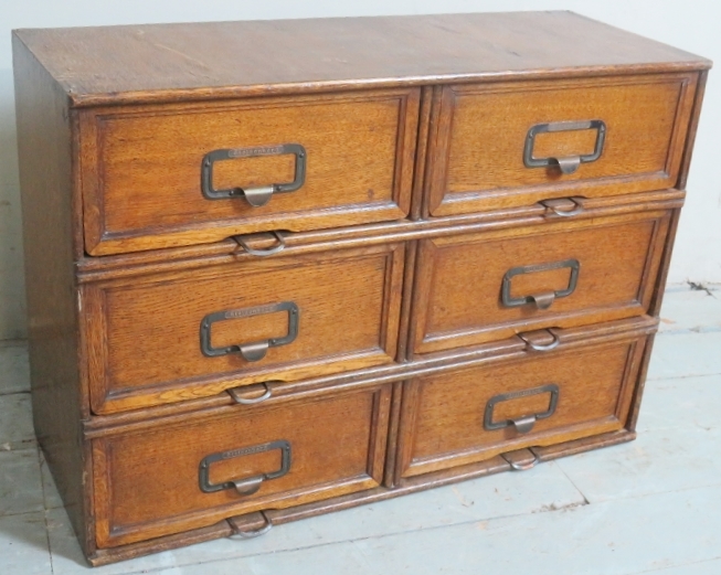 A 20th Century vintage oak table top or wall hanging filing cabinet with six drawers each having