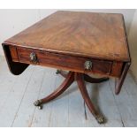 A 19th Century mahogany drop leaf Pembroke table with a single drawer to one end with lion mask