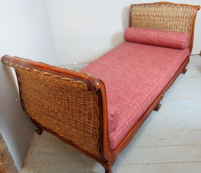 An elegant 20th Century mahogany framed day bed with whicker head and foot boards and having loose