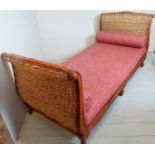 An elegant 20th Century mahogany framed day bed with whicker head and foot boards and having loose