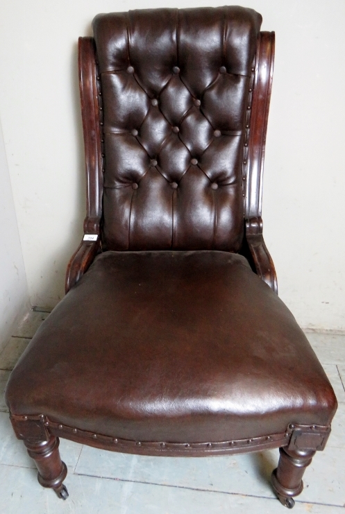 A Victorian mahogany framed library chair upholstered in button backed brown leather and - Image 3 of 5