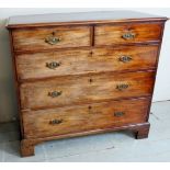 A good quality George III mahogany split chest of two short over three long graduated drawers with