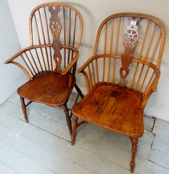 Two 19th Century country oak and elm wheel back armchairs with spindle upright supports over turned