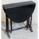 A small 19th Century ebonised Sutherland table with drop leaves,