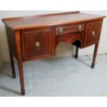 A Georgian cross banded flame mahogany sideboard with a central small drawer flanked either side by