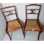 A pair of carved 19th Century occasional chairs with beige fabric upholstery to seats over turned