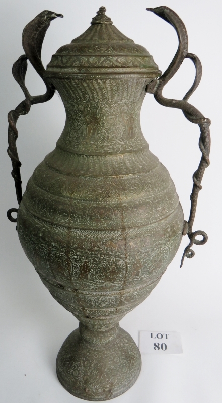 A large Indian brass twin handled jar wi