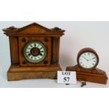 Two antique mantle clocks. One German H.A.C. 14 day strike in veneer wooden case. Height: 30cm.