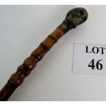 Bronze skull handled bamboo walking cane, length 108cm. Condition report: No issues.