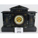 An antique French slate and marble striking mantel clock with enamel dial,