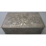 A white metal box with interior lid gilded, heavily decorated with leaves and flowers,