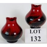 A pair of Royal Doulton red flambe veined vases, No 1605, 11.5cm tall. Condition report: No issues.