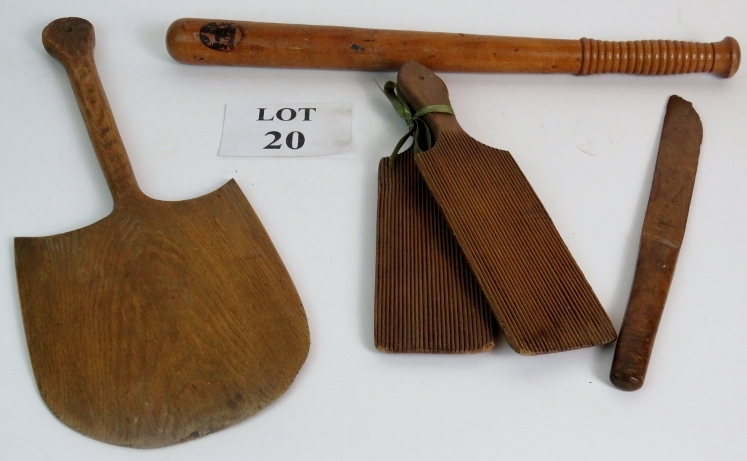 A selection of Treen items to include a truncheon marked Bank of England, a pair of butter paddles,