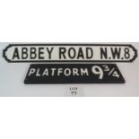 A reproduction painted wooden Abbey Road Street sign and a similar Harry Potter related 'platform 9