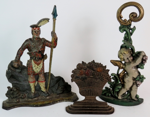 A mid 19th Century cast iron Scottish soldier door stop in original polychrome colours.