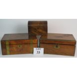 An antique dome topped walnut tea caddy and two brass bound writing slopes. All A/F.