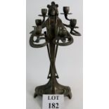 An Art Nouveau style cast metal fantasy female form, six branch candelabra, height 46cm.