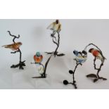 Five Albany bone china bird figurines, each mounted on lifelike copper branches.