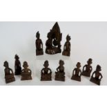 A set of 11 carved wood Balinese/Indonesian musicians and figures, tallest is 11cm.