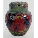 A Moorcroft covered jar decorated with birds and fruit design. Height is 11cm.