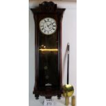 A continental Vienna type wall clock in glazed mahogany veneer case.