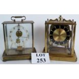 Two 20th century brass mantel clocks, one by Schatz, one by Kundo, both 22cm tall.