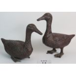 A pair of vintage bronzed duck garden ornaments. Largest: 35cm tall.