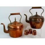 A set of 3 antique jelly moulds 3.5cm tall, and two large antique copper kettles, tallest 33cm.