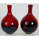 A pair of Royal Doulton red flambe veined vases, No 1606, 11.5cm tall.