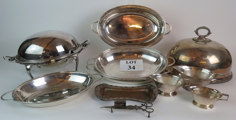 A set of Art Deco Roberts & Belk silver plated sauce boats, a Mappin & Webb roll top serving dish,