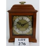 A reproduction Georgian style bracket clock in mahogany case, with 'Empire' striking movement.