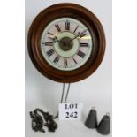 A 19th century 'Postman's Alarm' clock with glass dial and mahogany surround, diameter 28cm.