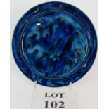 A blue glazed William Howson Taylor (Ruskin) style plate, 21.5cm diameter. Unmarked.