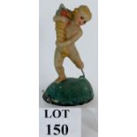 An early plastic model of a cherub or putto with a cornucopia, C1910. Height is 21.5cm.