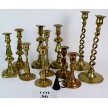 A selection of antique and later candlesticks comprising of five pairs and one single and a snuffer.