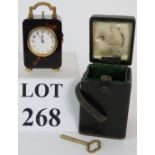 A very rare Asprey of London miniature repeating carriage clock in original travel case with key.