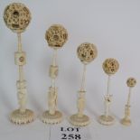 A set of 5 early 20th Century Chinese carved ivory puzzle balls and stands, tallest signed, 32cm,