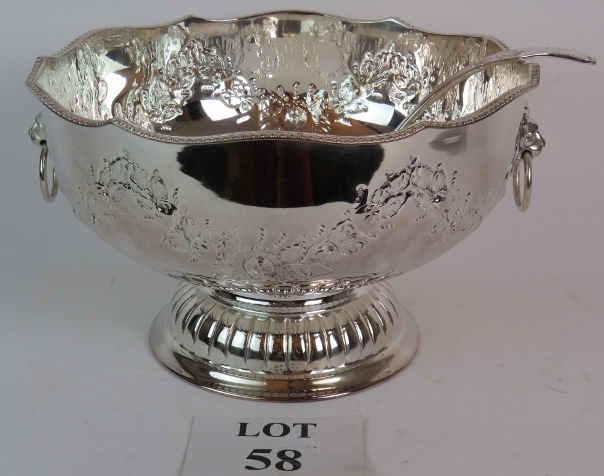 Silver plated punch bowl and ladle in antique style.