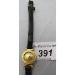 An 18ct gold ladies wristwatch on a leat