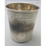 A French silver beaker with embossed flo