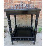 An Edwardian ebonised side table with a