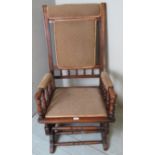 An Edwardian spindle rocking chair with
