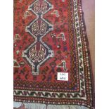 A mid 20th century Shiraz rug, three tie