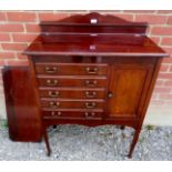 An Edwardian mahogany music cabinet with
