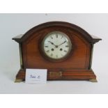 A French oak cased striking mantel clock