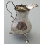 A Georgian silver baluster cream jug wit