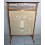 An Edwardian inlaid mahogany fire screen