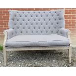 A contemporary high back two seater sofa