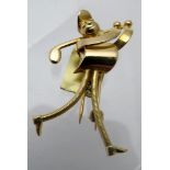 A stylish contemporary yellow metal brooch in the form of a golfer, bears indistinct marks,